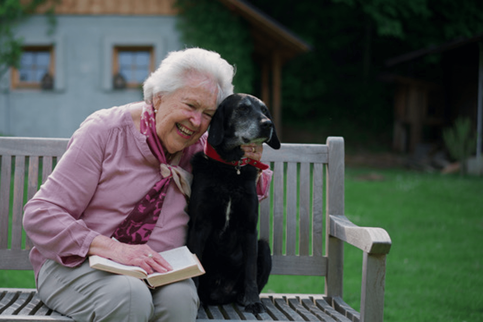 Elderly dog with a senior woman