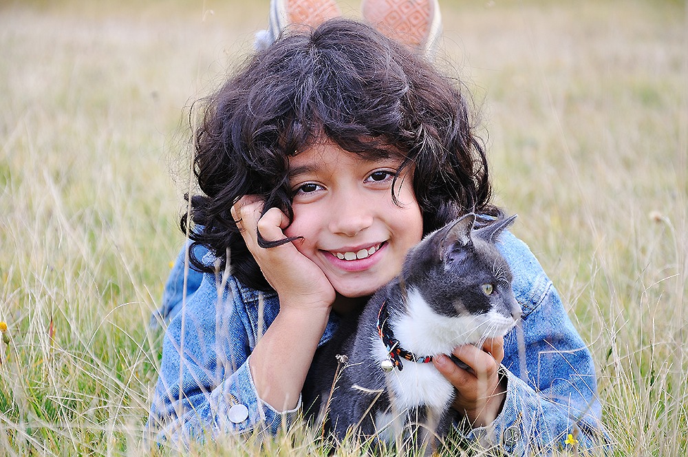 Kid with pet cat
